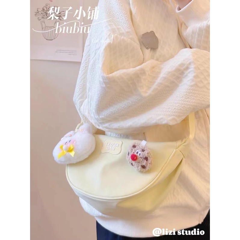 ◄Peri berbentuk bulan sabit tas Messenger tas wanita high-end ceruk desain kain nilon tas pangsit ta
