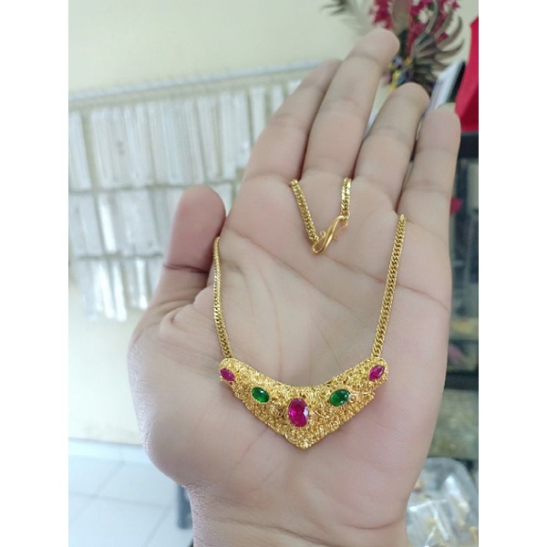 kalung titanium liontin minang kuningan