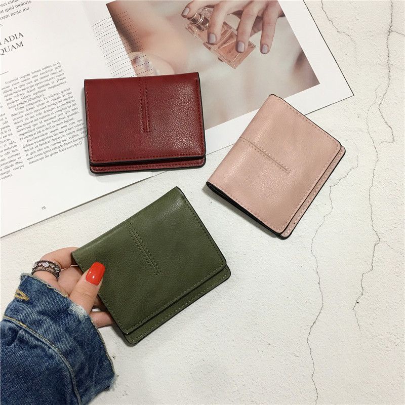 Sera pendek dompet kecil wanita bagian pendek 20% off baru ins Eropa dan Amerika sederhana ultra-tipis all-match gesper warna solid tas kartu kepribadian