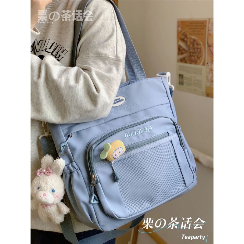 ✎☍►Sera  Toko Gaya Jepang Gaya Kuliah Tas Gadis Versi Korea Kapasitas Besar Messenger Tas Gadis Mahasiswa Komuter Tas Bahu