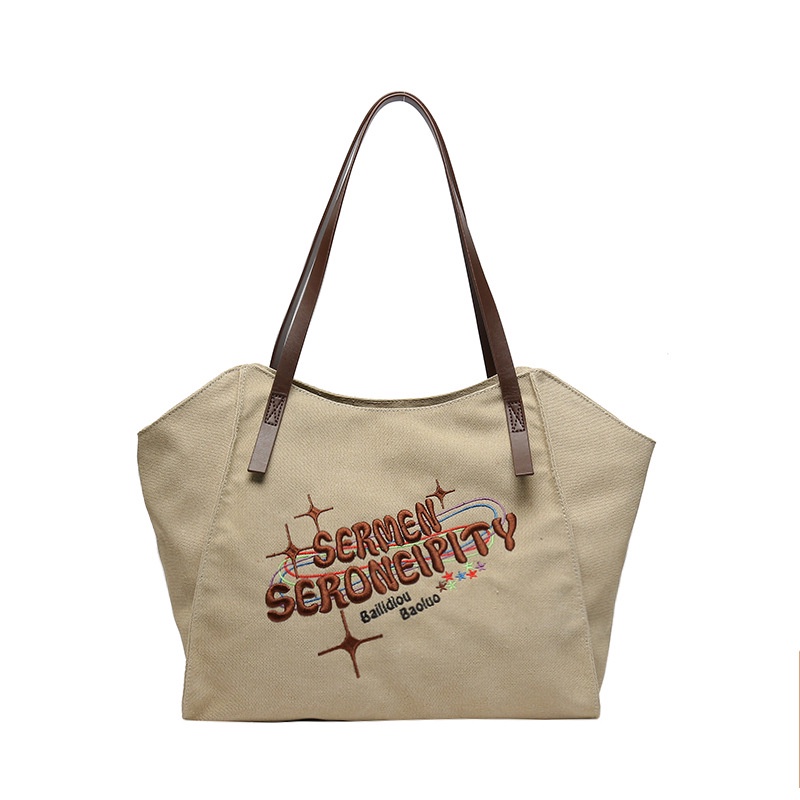 Red Tas kanvas berkapasitas besar wanita 2023 baru high-end niche tas bahu kelas komuter tas jinjing portabel