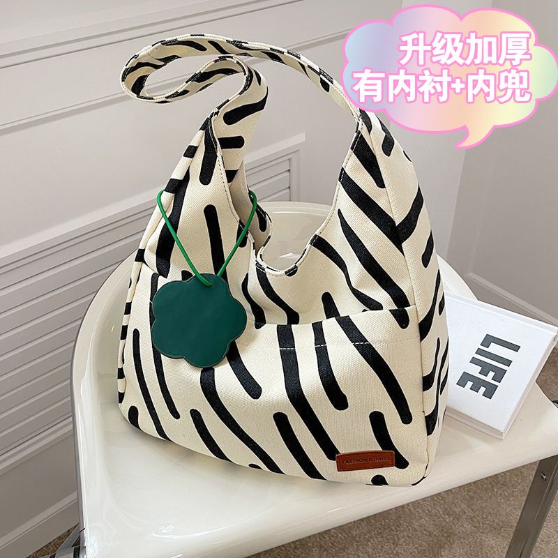 Sera zebra pola kanvas tas wanita 2023 baru angin malas Jepang berkapasitas besar tote bag siswa bepergian di satu bahu di kelas