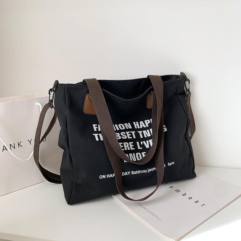 ∋✈▧Sera Kapasitas Besar Tas Kanvas Wanita 2023 Baru Kasual Malas College Messenger Tas Portable Tote Tas Mahasiswa Tas Sekolah