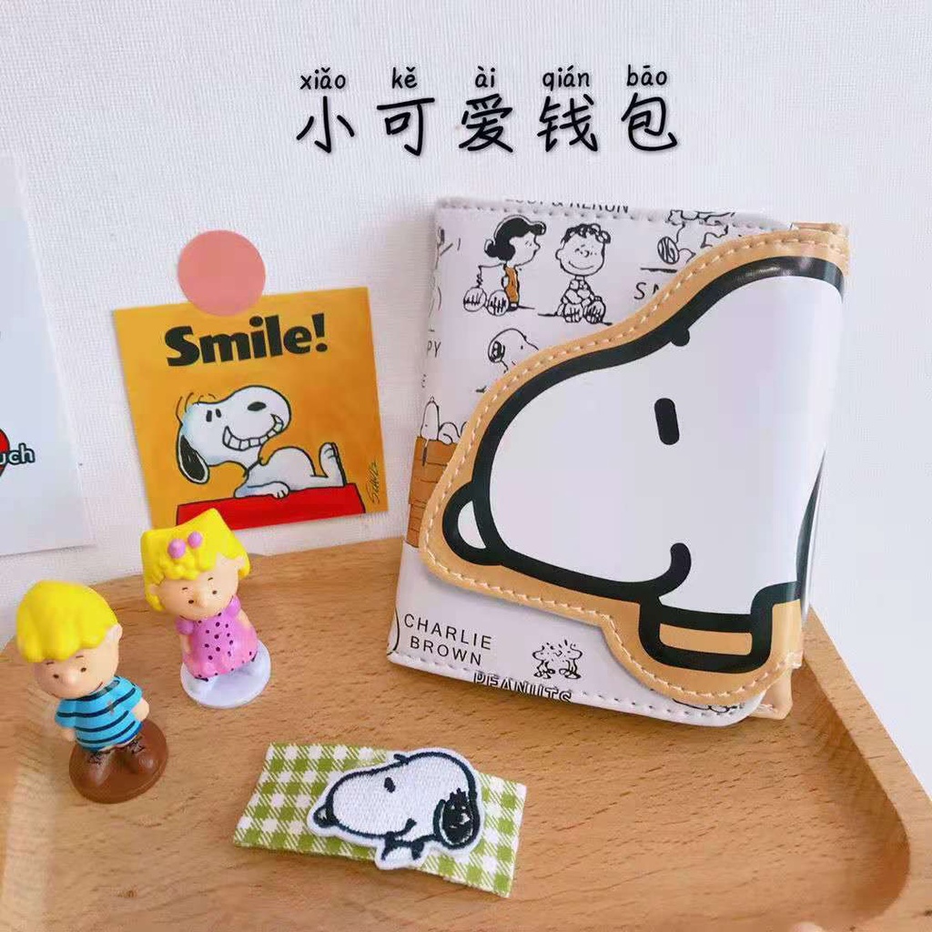 Dompet Sera Snoopy hadiah ulang tahun wanita 2021 baru asli dalam dompet pendek wanita siswa kartun Jepang dan Korea