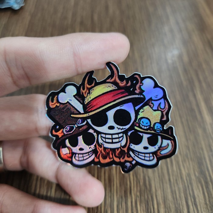 

Sticker Hologram Anime - PSH1722 - One Piece - Logo Luffy Ace Sabo