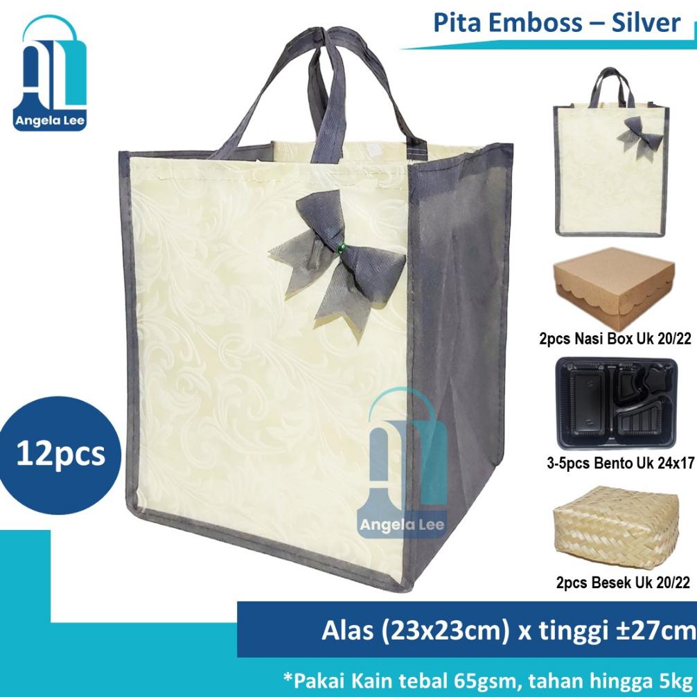 

Miliki 12pcs Tas Kain Spunbond Pita Emboss Polos muat 2 box nasi kotak Besek 20/22cm Hajatan Syukuran Pesta