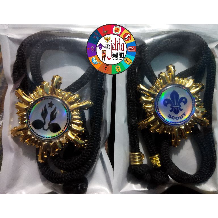 

Terbaru 10.10 RING KACU TALI PRAMUKA VIRAL TERBARU WARNA EMAS