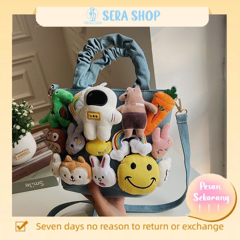 

✎Sera kartun tas niche denim kanvas gaya lucu boneka boneka genggam utusan tas wanita 2021 tas baru