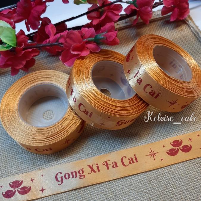 

IMLEK !! PITA CNY/IMLEK/CHINESE NEW YEAR WARNA GOLD UKURAN 2,5 CM-18 METER TERLARIS