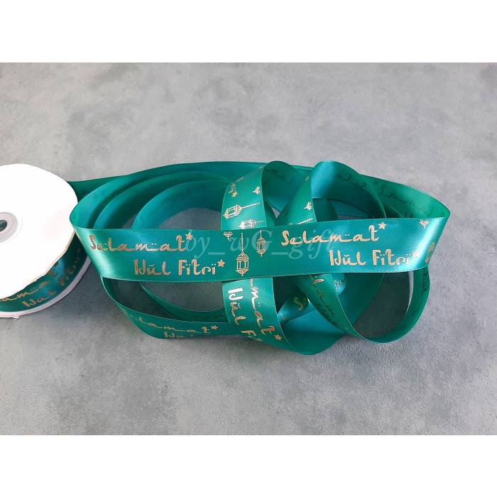 

Pita Idul Fitri -Satin Emboss Emas Motif A ;Lebar 3.8 cm; Tosca