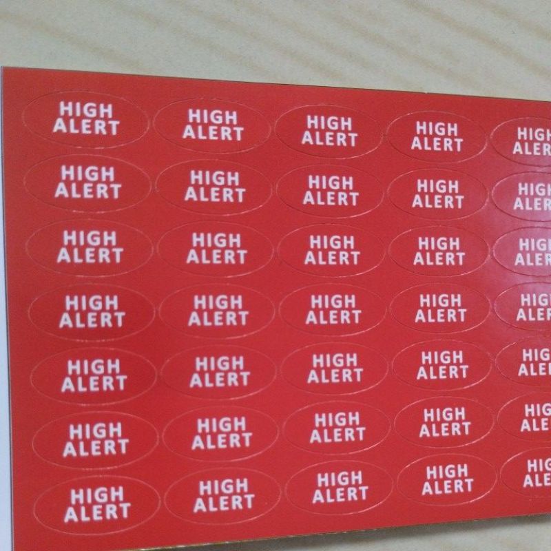 

stiker label high alert merah oval