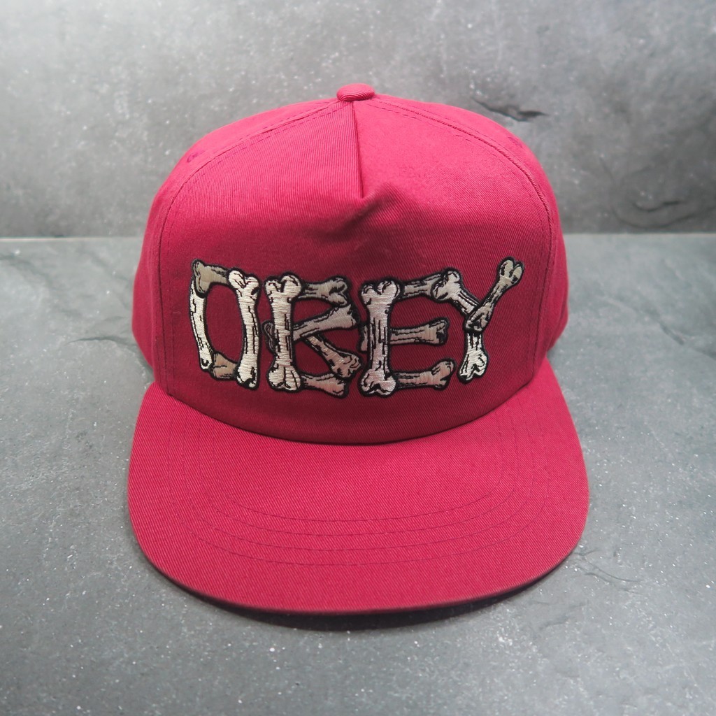 Topi Obey - Snapback Cap - OBY Propaganda Skull Logo