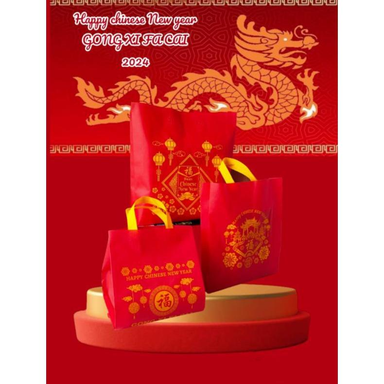

Sale !! Tas Spunbond Imlek / Goodie Bag Motif Gong Xi Fa Chai Terlaris