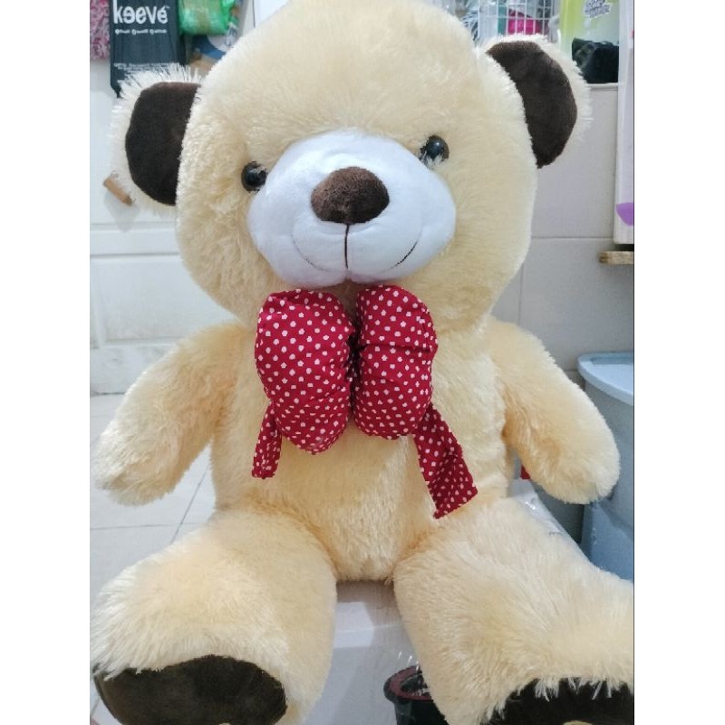 Boneka capit beruang besar pita merah