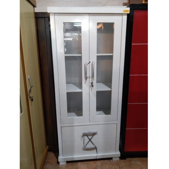 

Lemari Buku Minimalis Kaca Kristal 2 Pintu Cat Duco