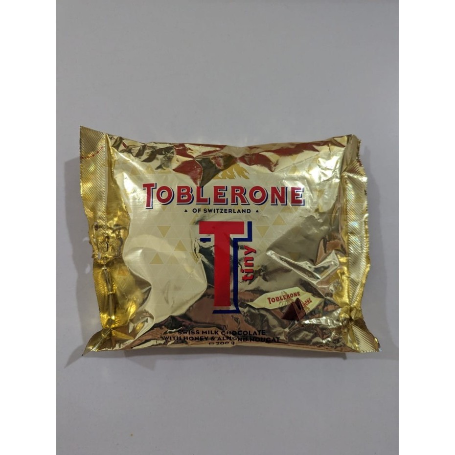 

Ready TOBLERONE TINY GOLD 200gr isi 25 PCS