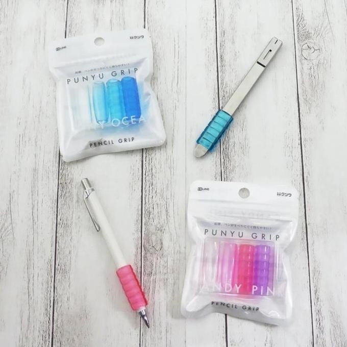 

Kutsuwa Punyu Pencil Grip Triangular Circular Elastomer Rubber Grip Handle Untuk Pensil Pulpen New Stok