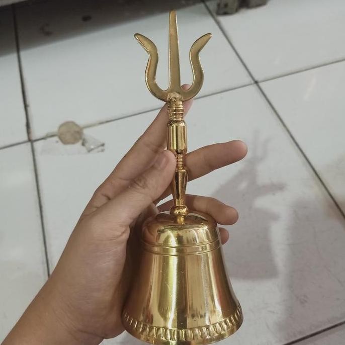 Lonceng Trisula Kuningan Puja