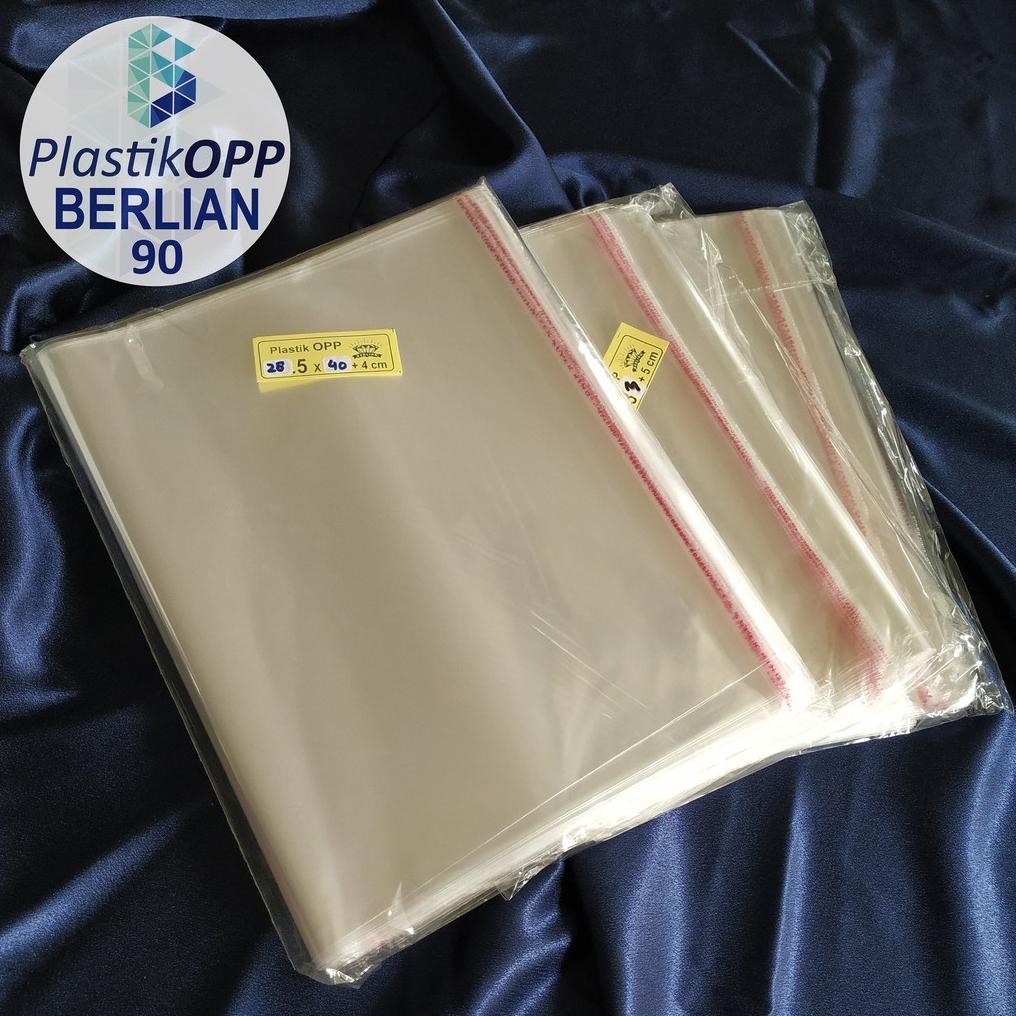 

Plastik OPP 28,5 X 40 CM 20 MIC 100LBR Lem Atau Seal / Plastik bening kemasan bungkus baju gamis celana garment termurah Nugi