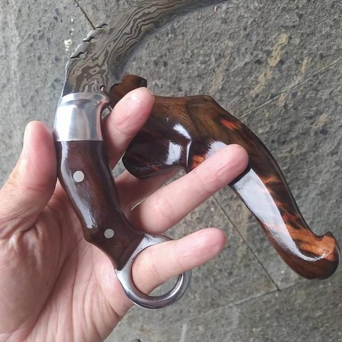 

Pisau Kerambit Silat Baja Pamor Damaskus Balik Mipih Ukir