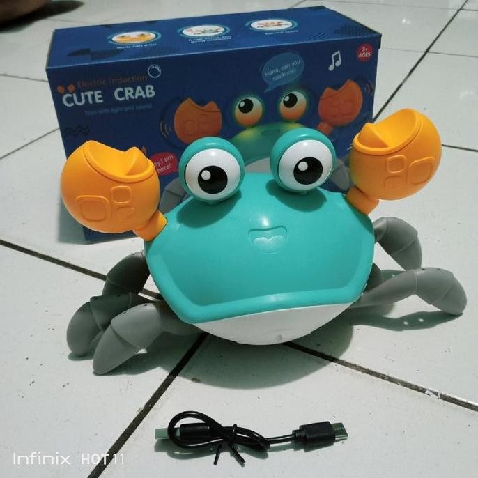 Mainan Kepiting Sensor Cas Lampu Dan Musik
