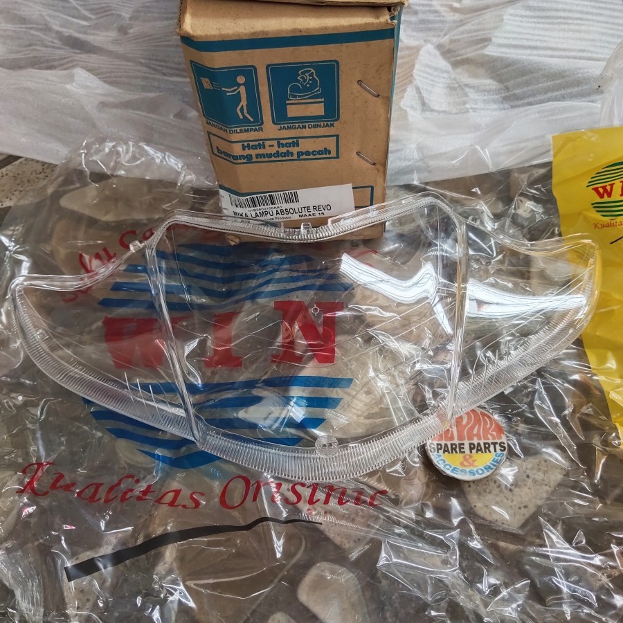 Mika lampu depan Revo 110 Absolute