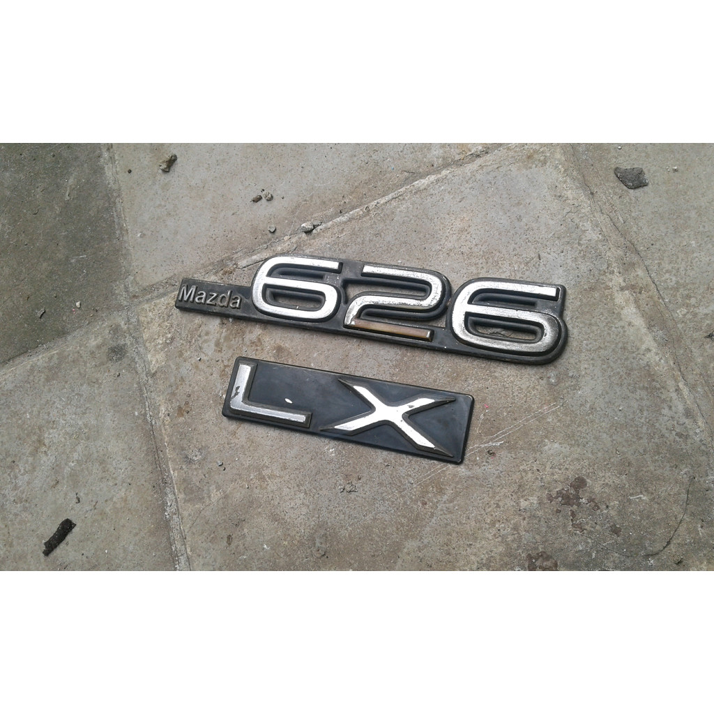 emblem bagasi mazda 626 lx