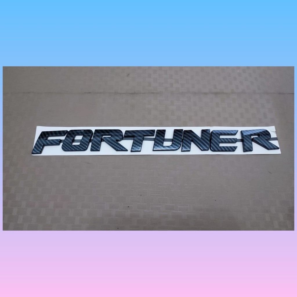 emblem kap mesin tulisan fortuner warna carbon