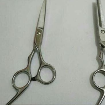 Gunting rambut biasa dan zigzag