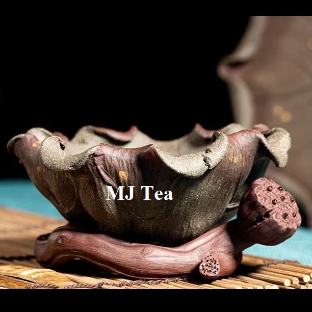 

Yixing Purple sand handmade lotus leaf tea divider & tea filter