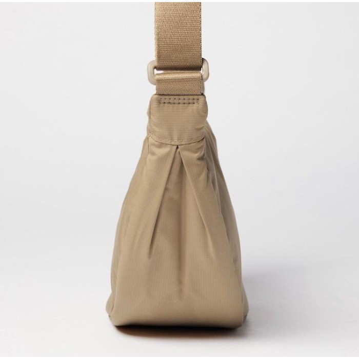 TAS BAHU MINI ROUND - SLINGBAG UNIQLO