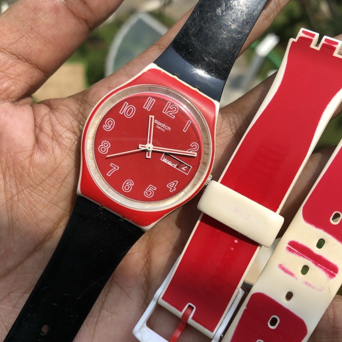 Jam swatch merah strap hitam