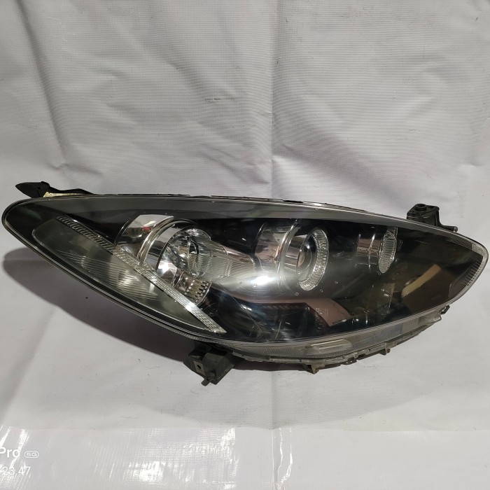 Lampu depan headlamp Mazda 2 RZ 2012