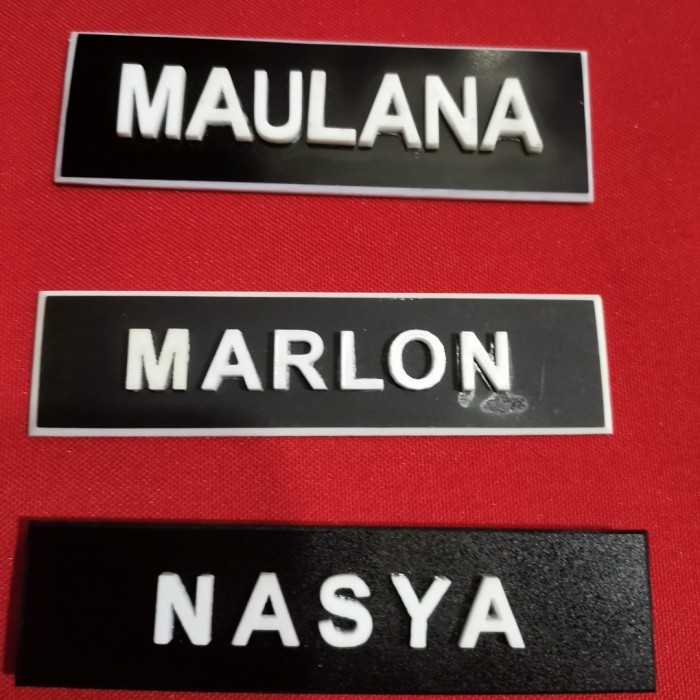 

Name Tag Timbul