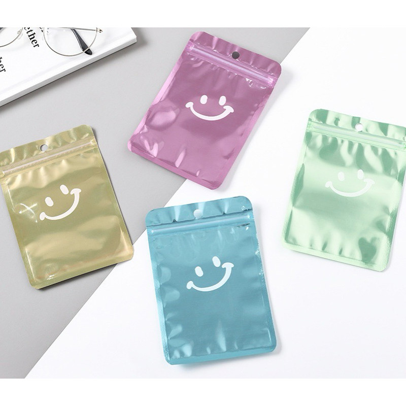 

Plastik Ziplock glossy warna /fancy plastik klip Smiley ( 10,5 x 15 cm )