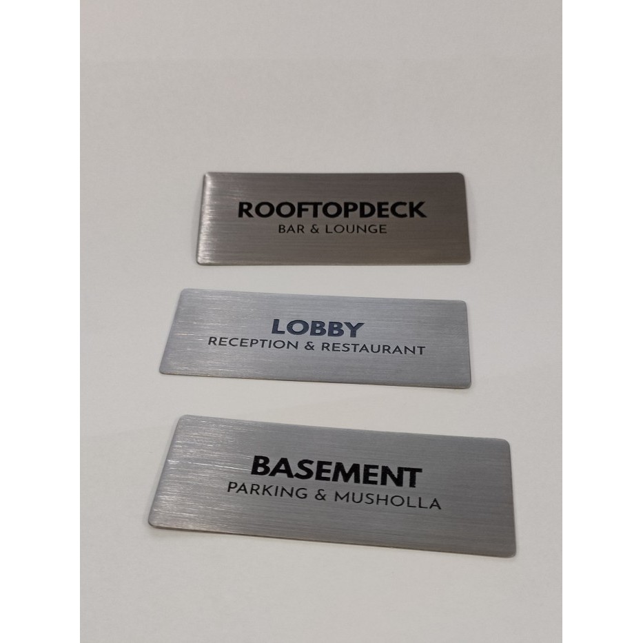 

papan nama stainless