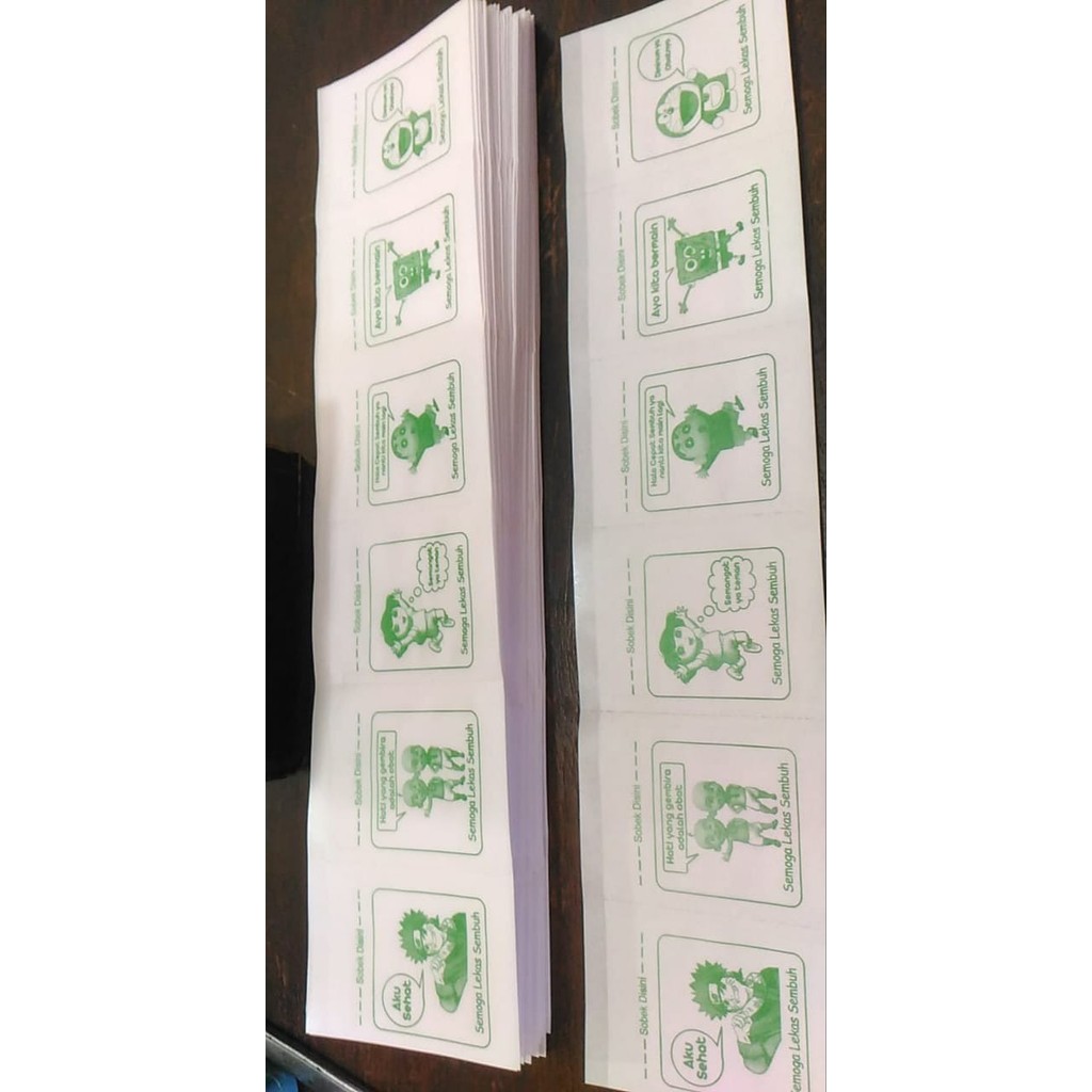 

Kertas Bungkus/Kertas Puyer Press Logo Kartun Hijau Isi 1.200 Kantong