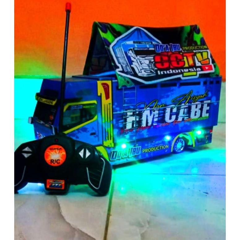 MAINNAN ANAK EDUKATIF MINIATUR TRUK OLENG FUL FATIASI REMOT KONTROL LAMPU WARNA DAN TERPAL TERLARIS 
