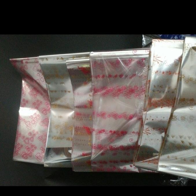 

#@#@#@#@] plastik bening bungkus parcel bening motif