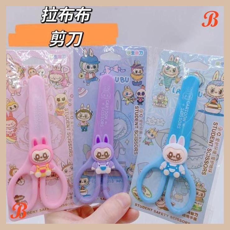 

| KK | GUNTING SANRIO ANTI KARAT DENGAN TUTUP MOTIF CINAMOROL KUROMI MELODI