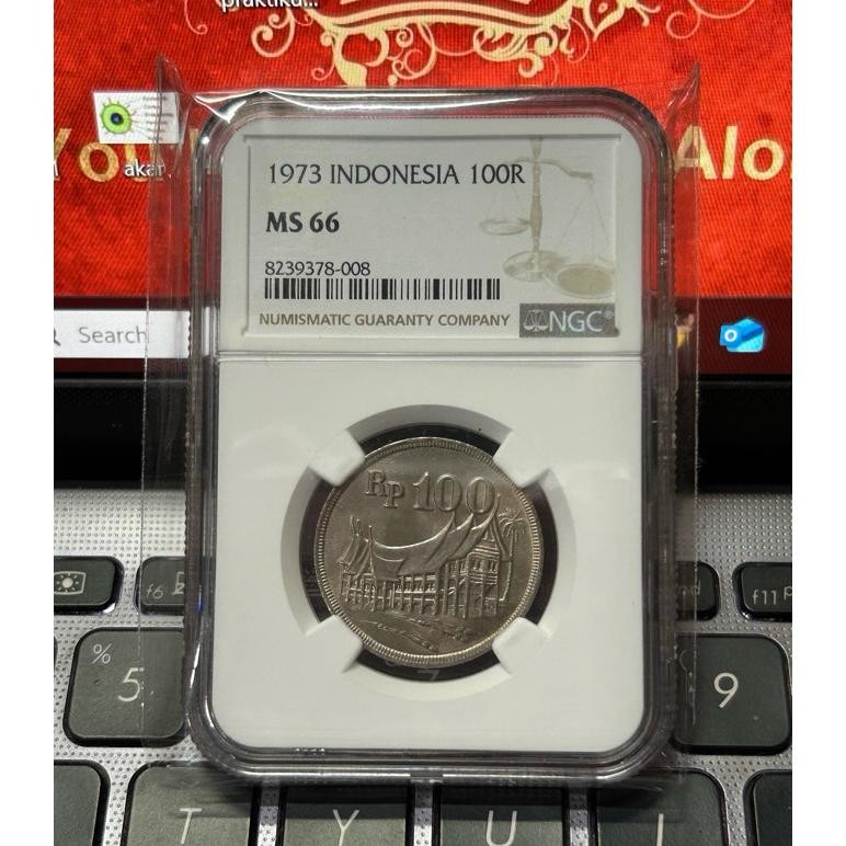 KOIN 100 Rupiah TEBAL RUMAH GADANG 1973 SERTIFIKASI NGC MS 66