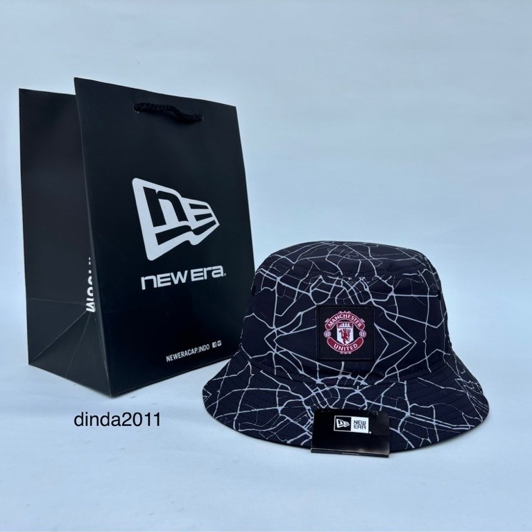 Topi NEW ERA AOP BUCKET HAT MU Original