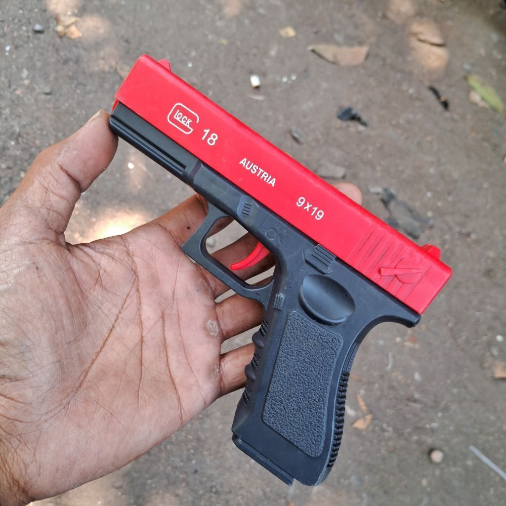 mainan pistol kokang