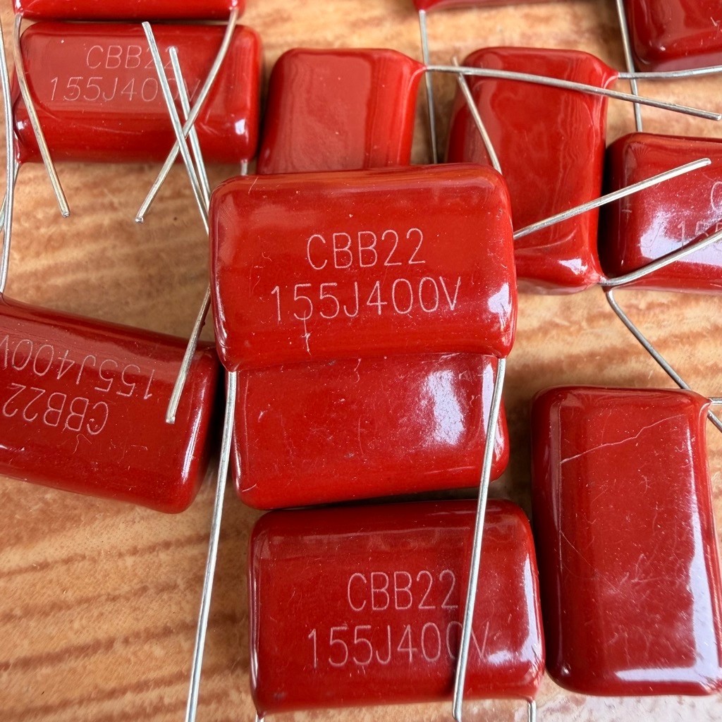 CAPASITOR MILAR MERAH 155/400 155J 400V