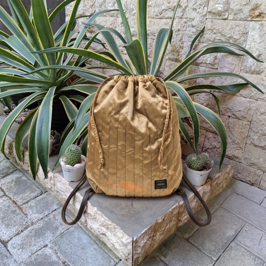 PORTER YOSHIDA & CO TANKER STRIPE MINI DRAWSTRING BACKPACK