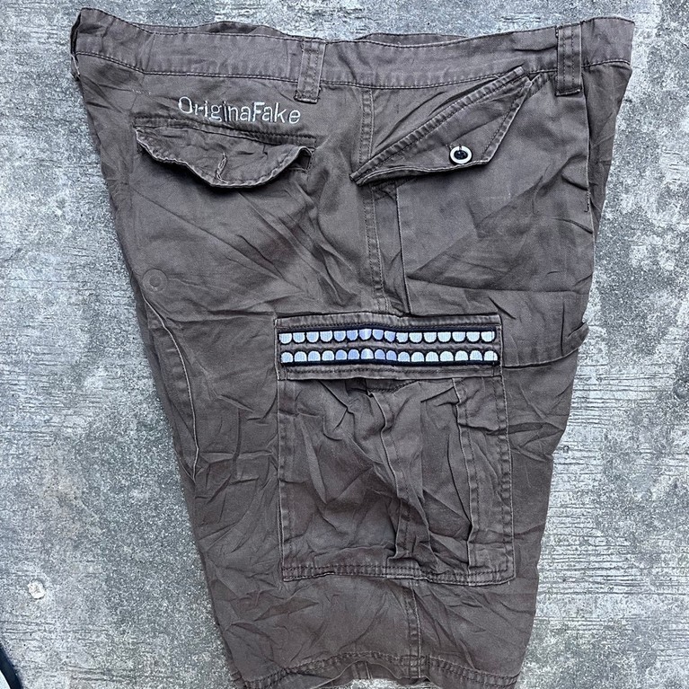 celana pendek cargo kaws original fake second