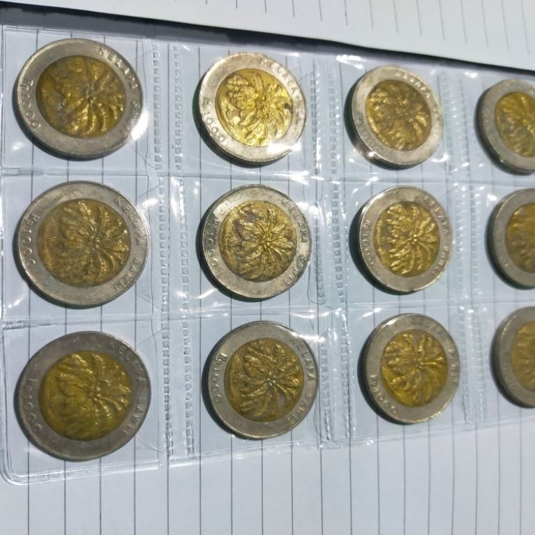 Koin pecahan 1000 sawit tahun 1996