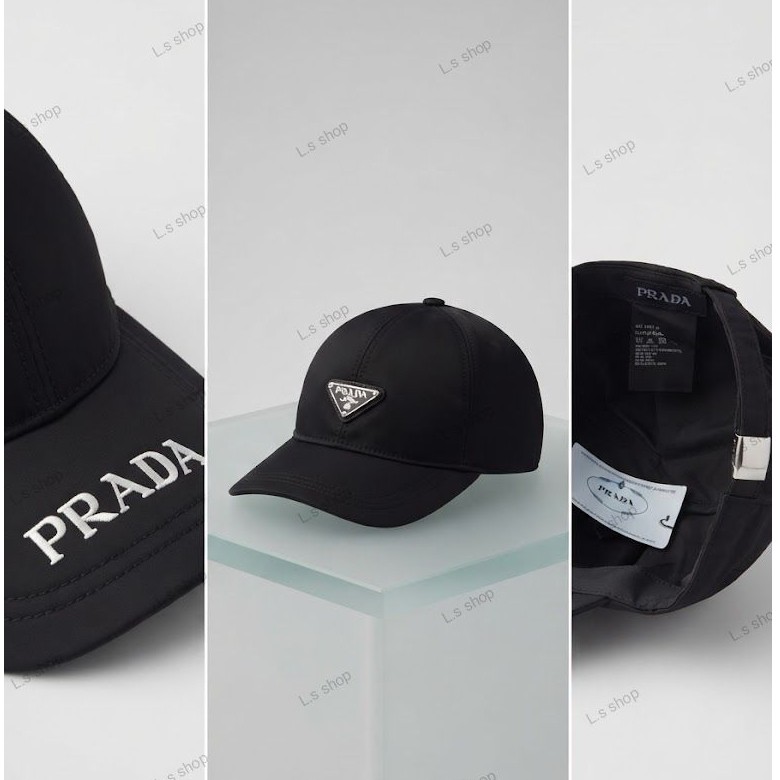 Topi baseball PRADA hitam dengan logo segitiga dan tulisan PRADA