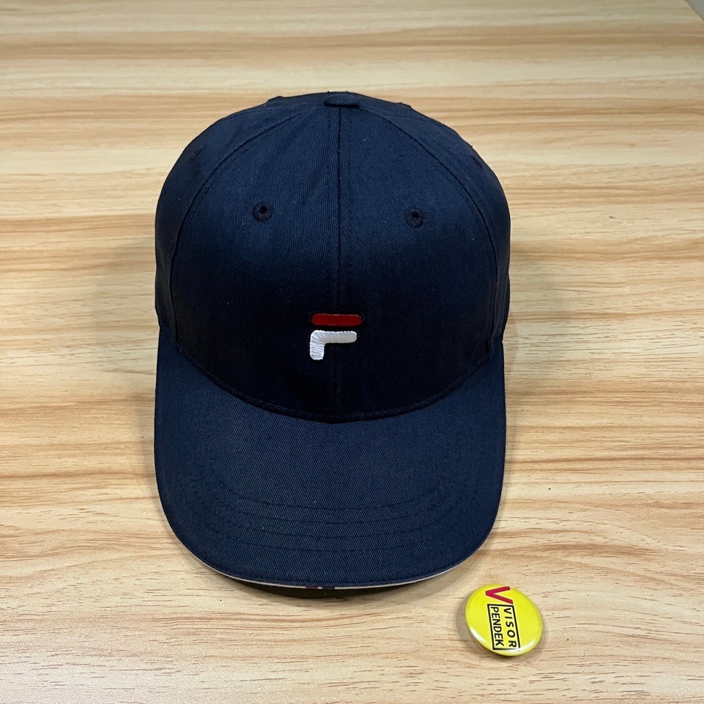 topi fila logo simpel warna dark navy