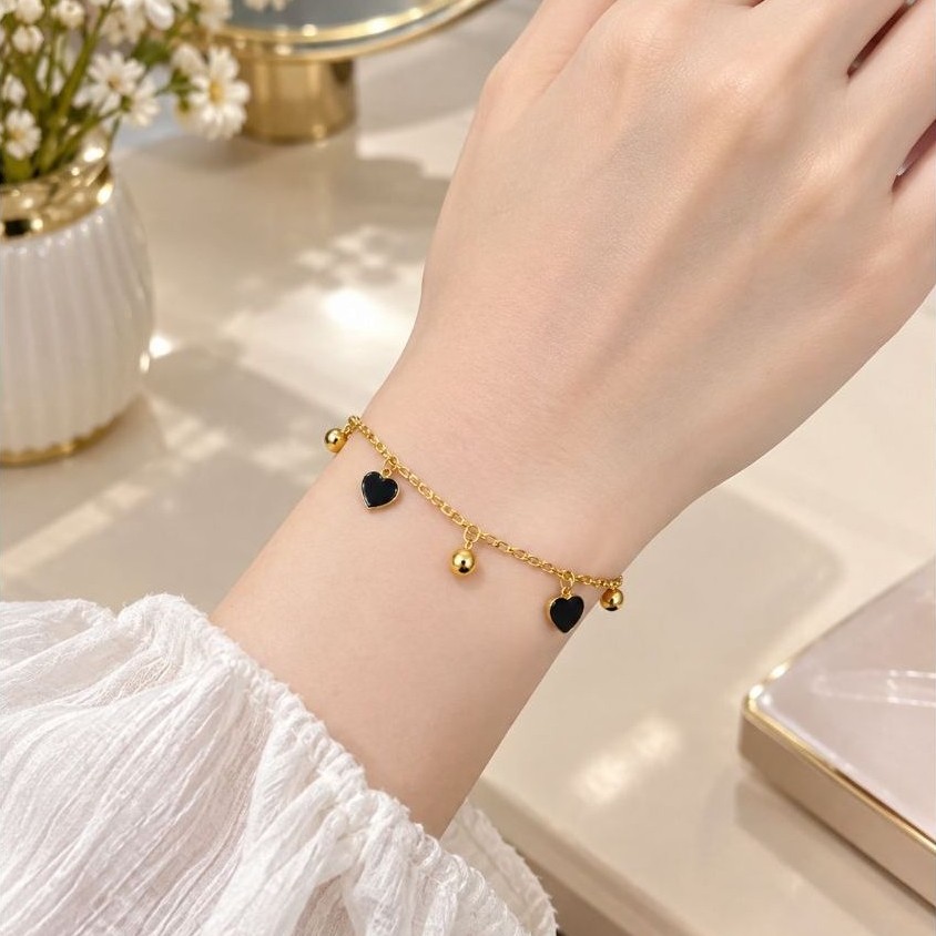 Gelang Titanium wanita rantai emas dengan gantungan hati hitam dan bola kecil